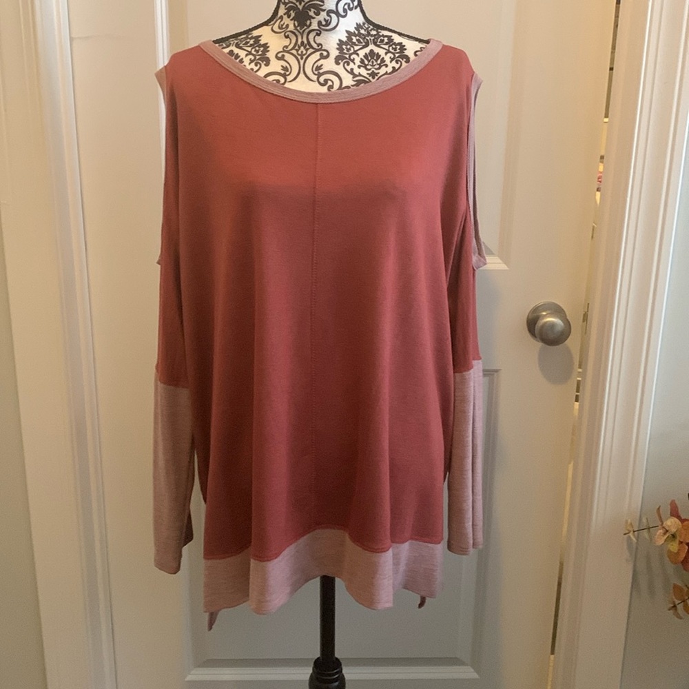 NWOT.  Woman’s two tone long sleeve boatneck style top with cut out shoulders.